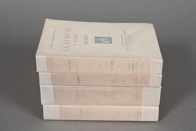 three books stacked on top of each other on a table