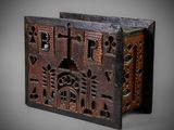 an old wooden box with carvings and carvings on it