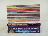 many books stacked on top of each other on a table