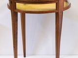an image of a small table with a glass top and wooden legs