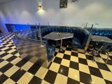 a black and white checkered floor in a restaurant