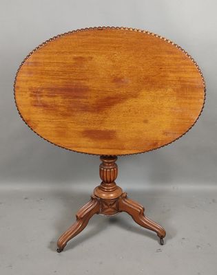 a small table with a wooden top on a wooden stand