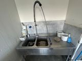 a sink with a faucet and a sink with a faucet