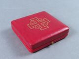 an image of a red box with a gold cross on it