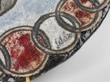 a close up of a plate with a design on it