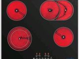 une image représentant une plaque de cuisson noire et rouge à quatre feux