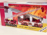 a box with a toy fire truck and a fire engine