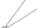 a close up of a diamond heart pendant on a chain