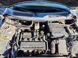 the engine of a car with its hood open and the hood down