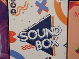 three boxes of sound boxes sitting on a table