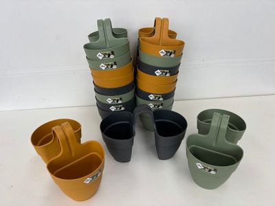 many pots that are sitting next to each other on the table