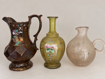 three vases sitting next to each other on a table