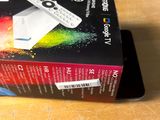 a box that is sitting on a table with a remote in it