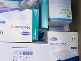 boxes of medicine and other medical supplies are stacked on top of each other