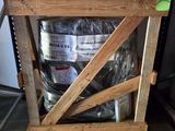 a wooden crate with a keg of beer inside of it