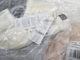 many items that are wrapped in plastic bags on the table