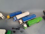 many toy trucks that are sitting on a table