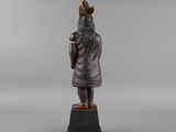 a bronze statue of a man with a beard and a hat
