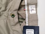 the back of a pair of khaki pants with a card attached to it