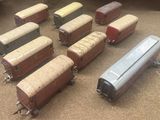 a lot of toy trains that are sitting on the floor
