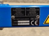 a close up of a sign on a blue bike