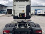 a large white truck parked in a parking lot