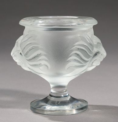 a glass vase that is sitting on a table