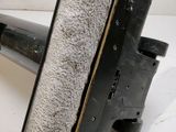 a close up of a black and white object on a white surface