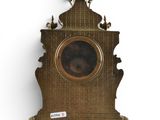 a clock that is on the wall with a picture on it