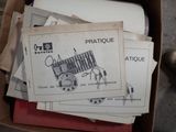 a box full of old paper and a pair of scissors in it