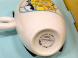 a coffee cup that is sitting in a yellow box