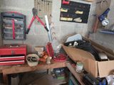 many tools on a workbench in a garage