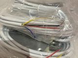 many cables that are wrapped in plastic on the table