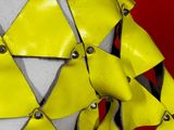 a close up of a yellow and grey costume on a mannequin mannequin