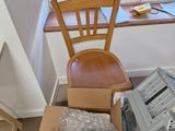 a desk with a computer and a chair in the room