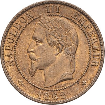 gros plan d'une pièce de monnaie sur laquelle figure une tête d'homme