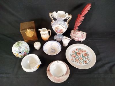 many different types of tea cups and saucers on the table