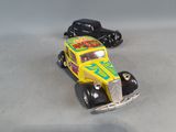 two toy cars that are sitting next to each other