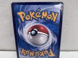 a close up of a video game case with a pokemon ball on it