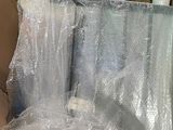 a box full of toiletries wrapped in clear plastic