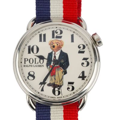 a close up of a watch with a polo bear on it