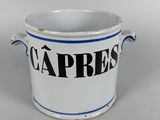 an image of a white and blue cup with the word capresss on it