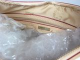 a bag of plastic wrap sitting inside of a purse
