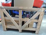 a wooden crate with a bunch of items inside of it
