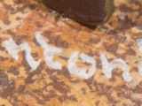 a piece of luggage sitting on the ground with writing on it