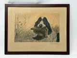 painting of a dog holding a bird in its mouth in a wood frame