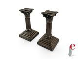 pair of antique bronze candlesticks on a white background