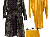 two coats and a skirt are hanging on a clothes rack