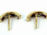 two pairs of gold earrings with purple stones on them