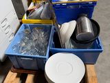 a pile of plates and bowls on a pallet in a warehouse